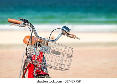 Red Vintage Style Bicycle Parked At Manly Beach, Australia