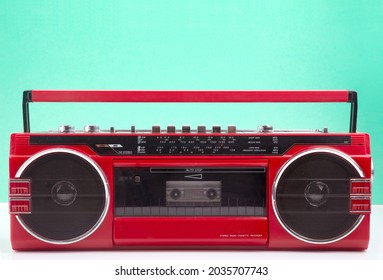 Red Vintage Tape Player Isolated On Green And White Background