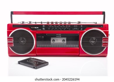 Red Vintage Tape Player Isolated On White Background With Black Cassette On Front