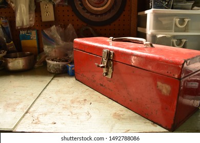 Red vintage toolbox on a table