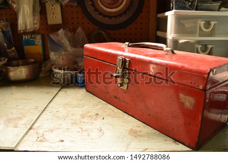 Red vintage toolbox on a table