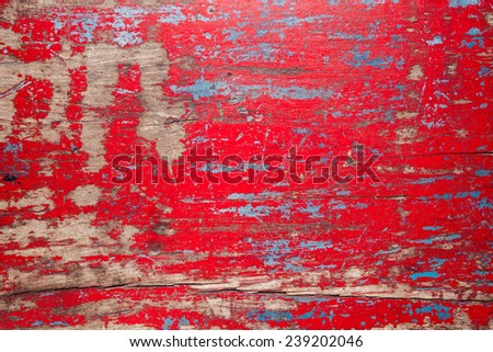 Red vintage wooden table background with chipped paint