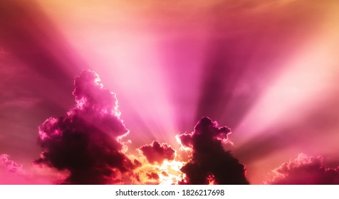 red violet and orange sunset light in overcast sky with fluffy cloudy - Shutterstock ID 1826217698