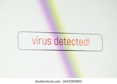 Red virus message on the screen, symbol of cybernetic threat. Warning "Virus detected" reflects digital danger, emphasizing the importance of cybersecurity in modern networks