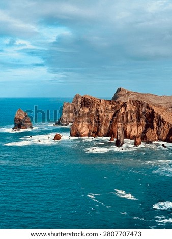 Red volcanic cliffs with sea stack in blue Atlantic Ocean at Ponta de Sao Lourenco Madeira Portugal
