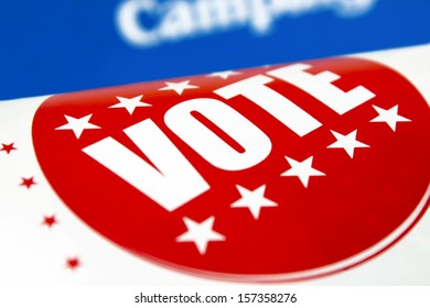 Red Vote Sticker Printed In A Political Newspaper Flyer