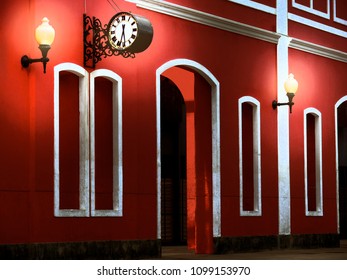red wall with old clock