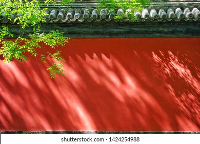 Red Wall With Shadows Of Leaves From The Forbidden City, Beijing