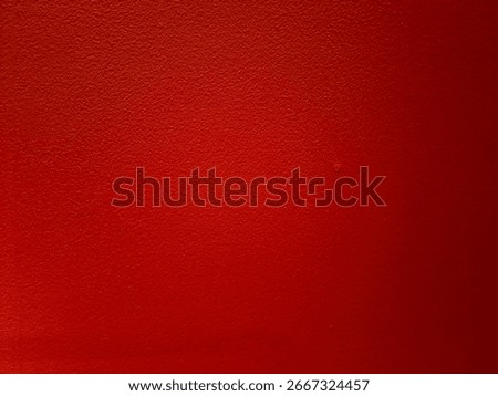 Red wall texture with rough surface detail, rustic painted background for construction, design, architecture, and decorative interior projects.