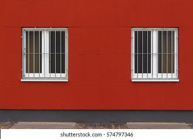 Red Wall with Two Windows protected by Gratings 