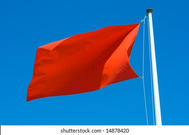 Red Warning Flag At The Beach