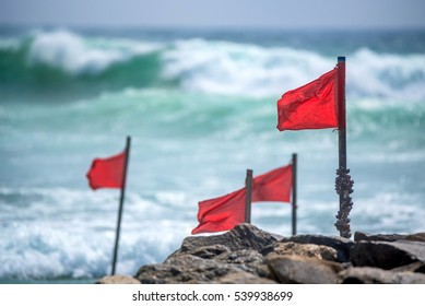 Red Warning Flag On Beach