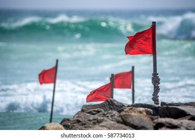 Red Warning Flag On Beach