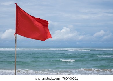 A Red Warning Flag On The Beach In The Nuca Dua Bali, Indonesia. Danger To Swim In Ocean