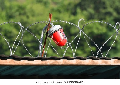 Red warning light with barbed wire on hazard zone
