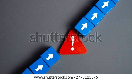 Red Warning Triangle with Exclamation Mark Breaking a Chain of Blue Arrow Blocks Symbolizing Error Detection and System Failure