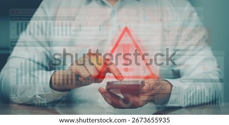 Red warning triangle icon over digital device, representing alert system, alarm notifications, and cybersecurity or system failure warning.