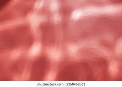 Red Water Ripples Background -  Underwater Texture. Sun Shining Through Water.