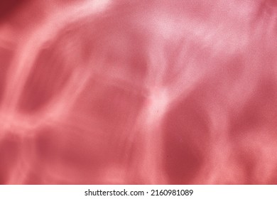 Red Water Ripples Background -  Underwater Texture. Sun Shining Through Water.