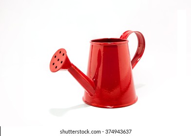 Red watering can on white isolated background.