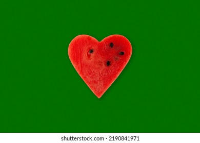 Red Watermelon pulp heart on green background. Design element. Watermelon slice. Season sale fruits  and berries. Positive emotions. - Shutterstock ID 2190841971