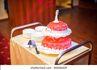 Red Wedding Cake Decorated With White Patterns