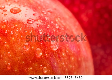 red wet apple with big droplet, macro shot