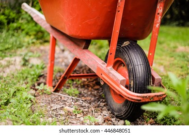 Red Wheelbarrow In The Garden