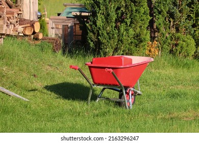 Red Wheelbarrow On The Grass