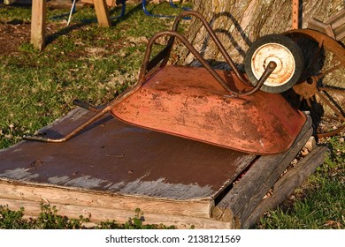 Red Wheelbarrow In A Yard