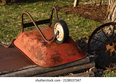 Red Wheelbarrow In A Yard