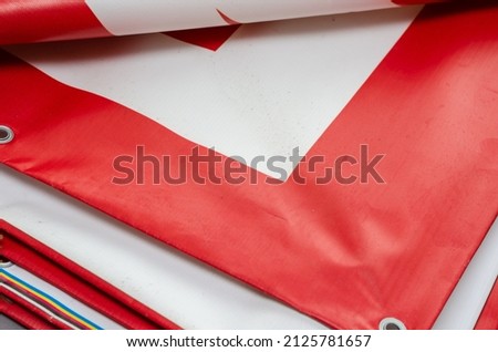 Similar – Image, Stock Photo Red PVC advertising banner hanging in folds on a metal fence with the inscription