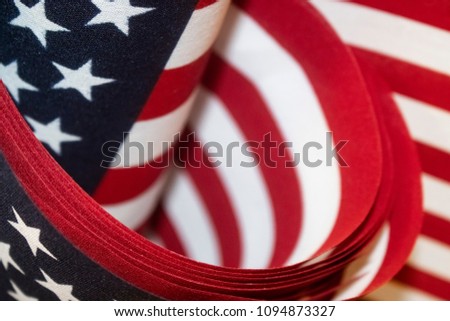 Red white and blue American flags background - selective focus