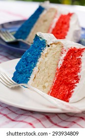 Red, White, And Blue Cake Slices On Plates