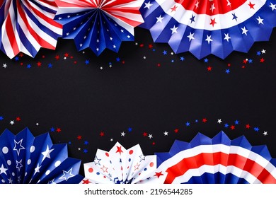 Red White And Blue Paper Fans With Confetti On Black Table. American Patriotic Birthday Party Decorations For USA Themed Event. Happy Labor Day Or Independence Day, 4th Of July Concept.