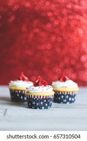 Red, White, And Blue Patriotic Cupcake With Red Sparkle Background