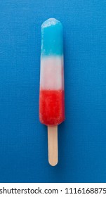 Red White And Blue Popsicle On A Blue Background