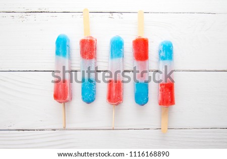 Red White and Blue Popsicles in a Bowl of Ice to Keep them Cool for Serving to your BBQ Guests