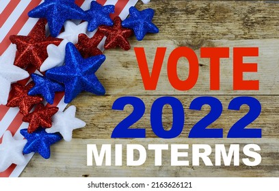 Red, White And Blue Stars And Stripes For The Upcoming Midterm Election In The United States Of America. Rustic Image With Wooden Background. 