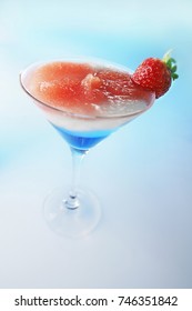 Red White And Blue Tasty Ice Cocktail With Strawberry.