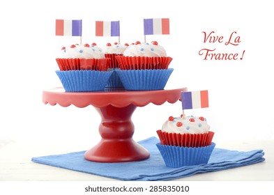 Red, White And Blue Theme Cupcakes On White Wood Table For Bastille Day Or French Party Celebration. 