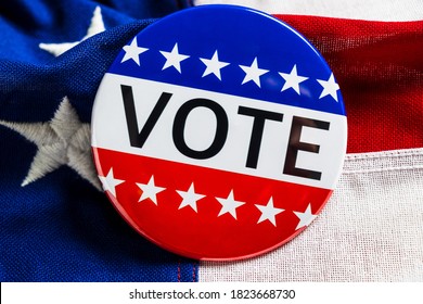 A red, white and blue VOTE button on an American flag