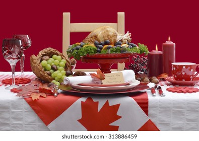 Red And White Canadian Theme Thanksgiving Table Setting With Flag And Roast Turkey Chicken On Large Platter Centerpiece . 