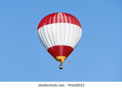 Red And White Captive Balloon On Blue Sky Background