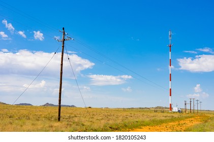 Red And White Cell Phone Tower In The Countryside Of South Africa