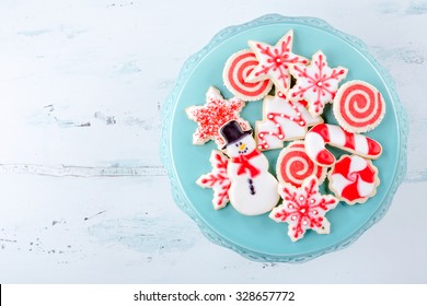 Red And White Christmas Sugar Cookies On A Plate