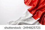 Red and White Fabric Indonesian Flag Draped on White Background for your background business, poster, wallpaper, banner, backdrop, greeting cards, and advertising for business entities or brands.