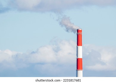 Red- white factory chimney on cloudy sky background with smoke - Powered by Shutterstock