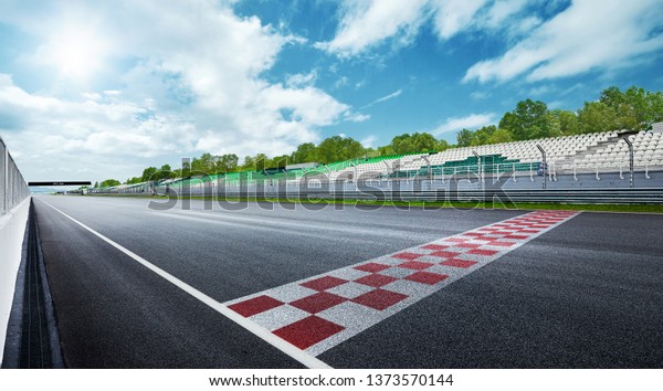 Red And White Finish Line With Dramatic View Of A Modern Race Track.