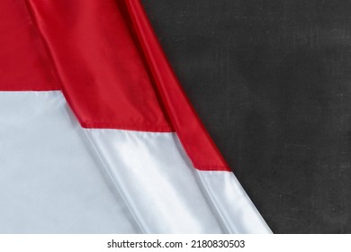 Red and white flag with a black background. Indonesian independence day - Shutterstock ID 2180830503
